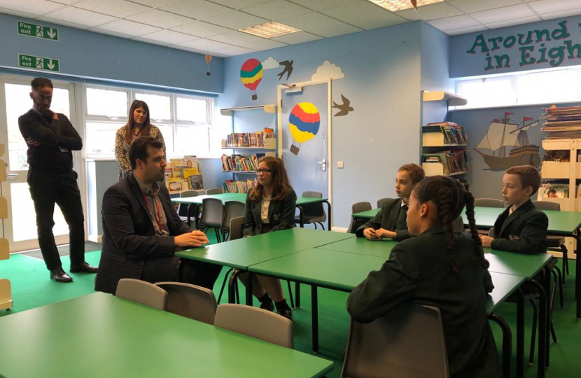 Elliot speaking to children at the school