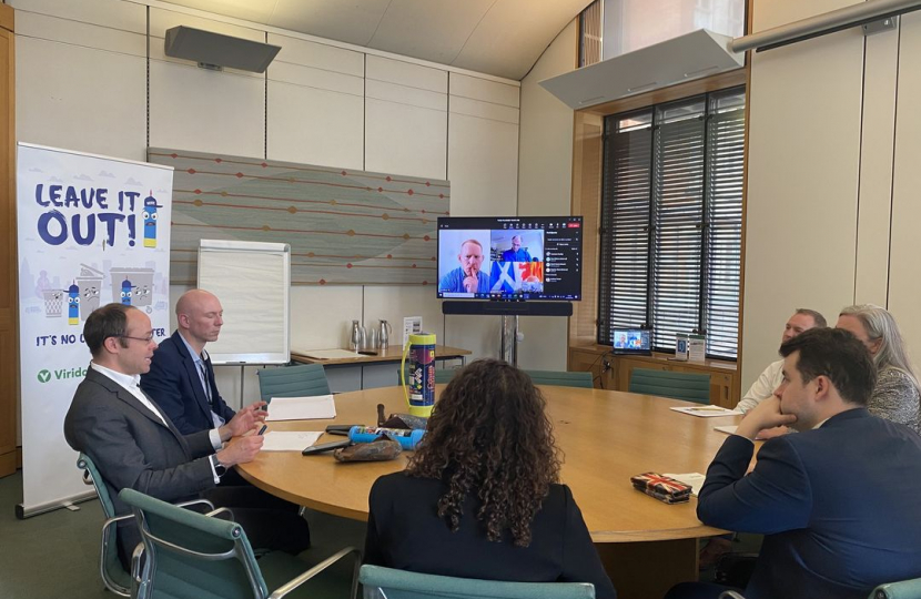 Elliot attending a roundtable to discuss dealing with the scourge of laughing gas and the canisters it comes in.