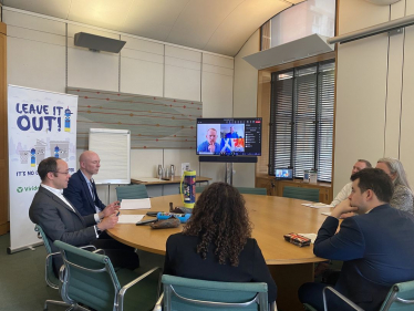 Elliot attending a roundtable to discuss dealing with the scourge of laughing gas and the canisters it comes in.